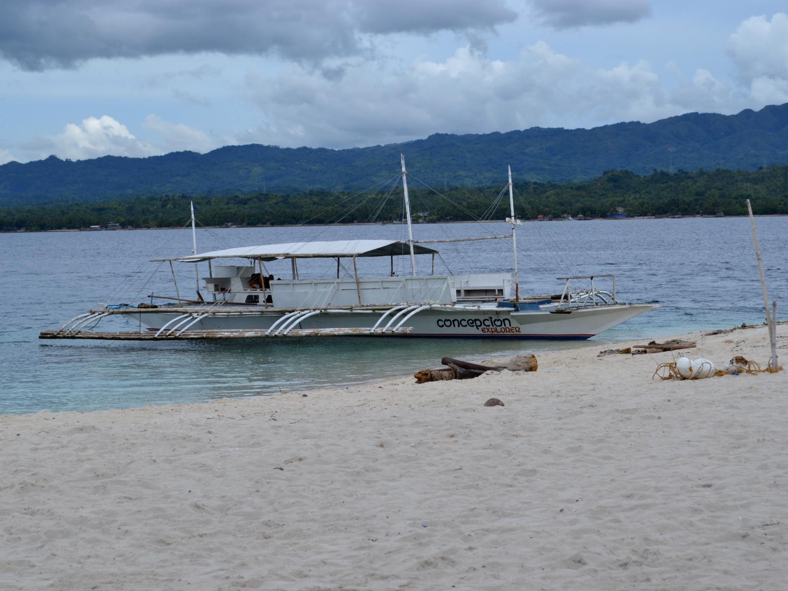 Conception Explorer Waiting on Beach at Canigao Island, Philippines