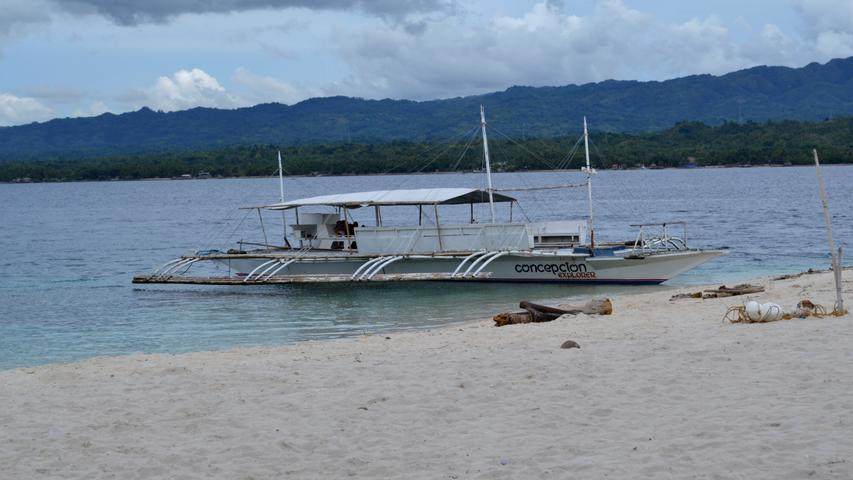 Conception Explorer Waiting on Beach at Canigao Island, Philippines