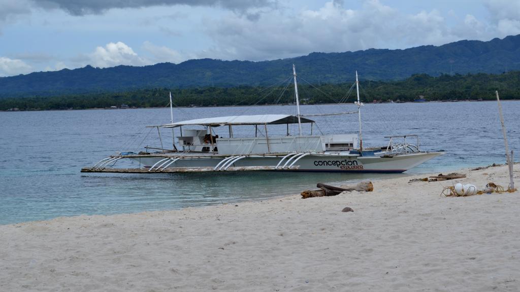 Conception Explorer Waiting on Beach at Canigao Island, Philippines