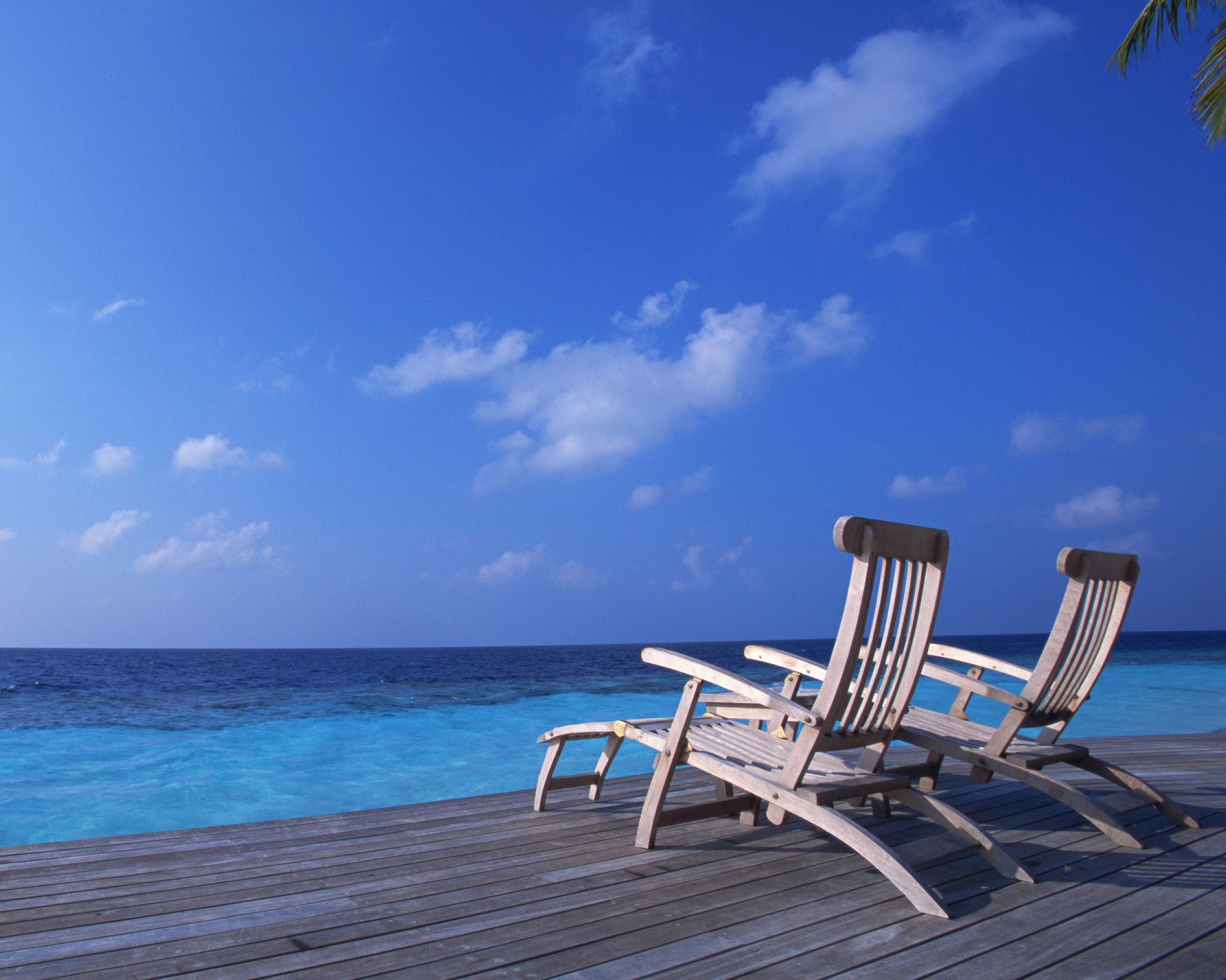 Deck Chairs On The Maldives Beach