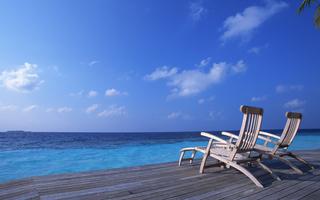 Deck Chairs On The Maldives Beach