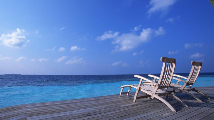 Deck Chairs On The Maldives Beach