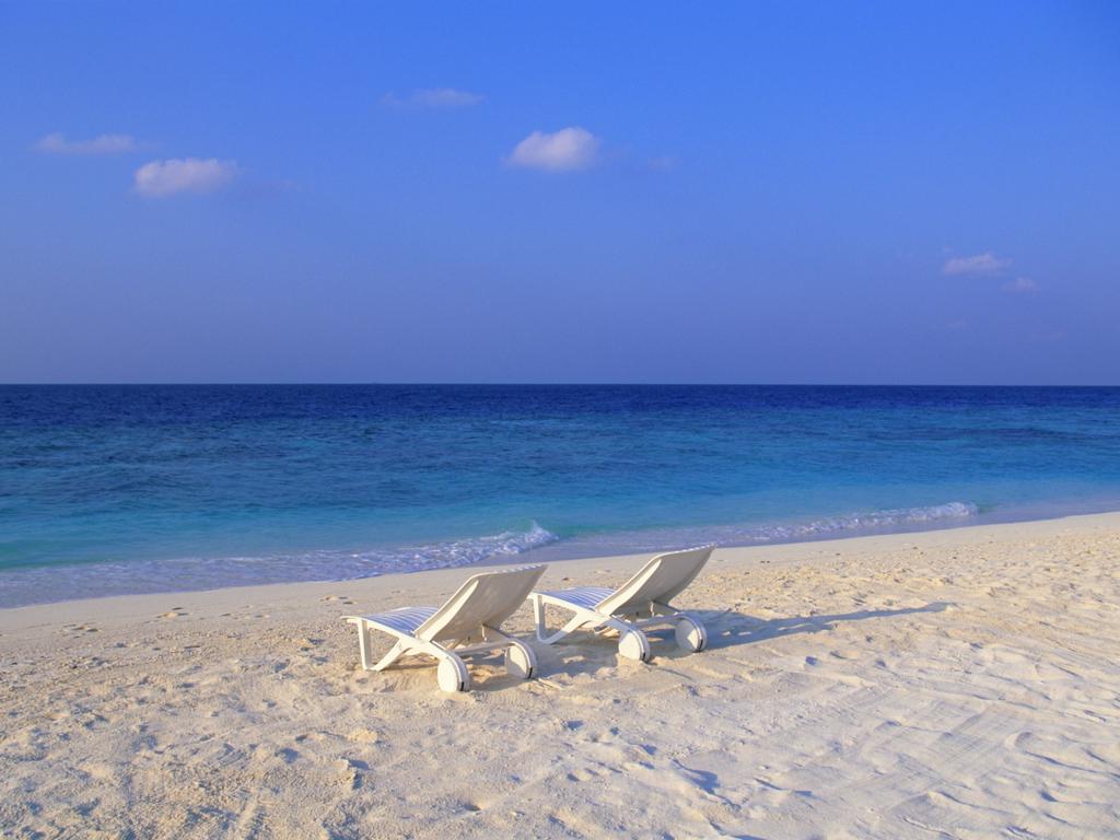 Deck Chairs on the Beach at Maldives