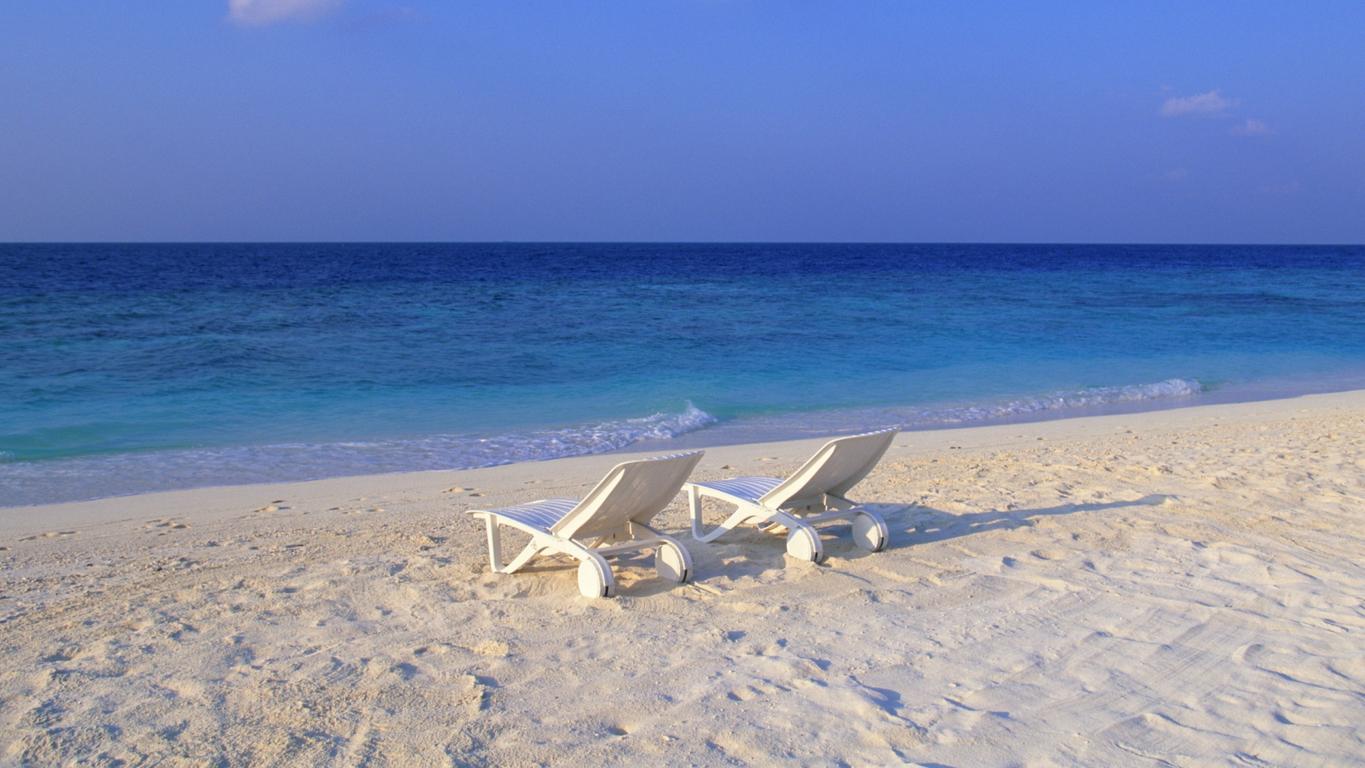 Deck Chairs on the Beach at Maldives