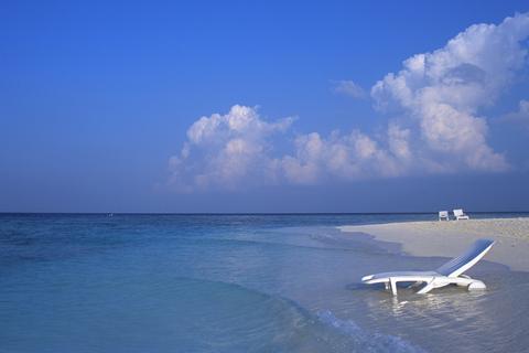 A Deck Chair in the Water on a Maldives Beach 3:2