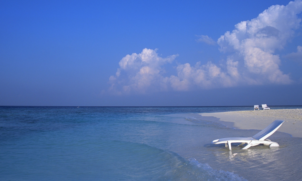 A Deck Chair in the Water on a Maldives Beach 5:3
