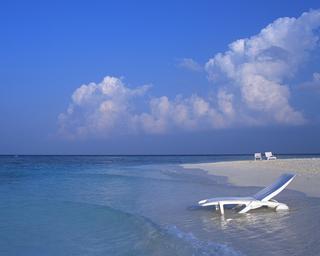 A Deck Chair in the Water on a Maldives Beach 5:4