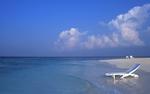 A Deck Chair in the Water on a Maldives Beach 8:5